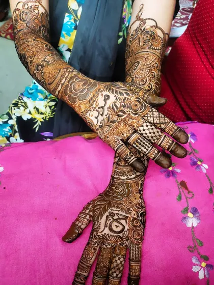 This bridal design combines traditional figures with floral and checkerboard patterns for a unique look.