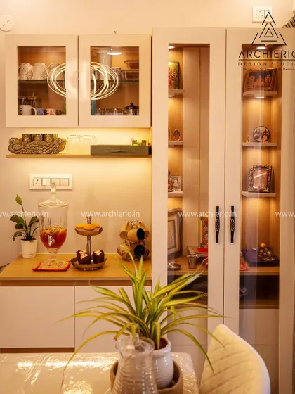 A beautifully organized crockery and pooja unit. The glass doors and internal lighting allow for a beautiful display of idols and fine dinnerware, blending spirituality with style.