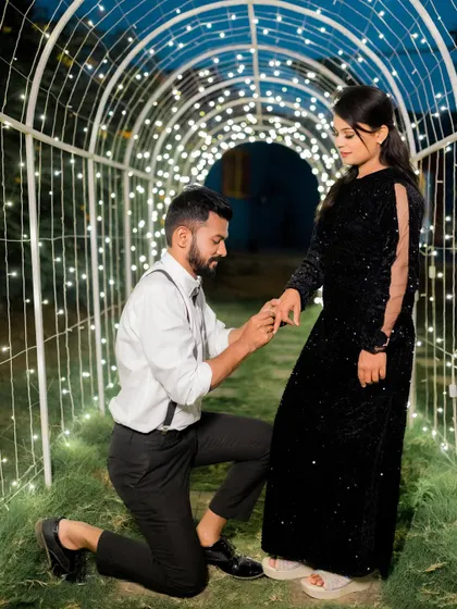 A classic proposal moment captured in a magical tunnel of fairy lights. This set provides a perfect, romantic ambiance for such a special memory.