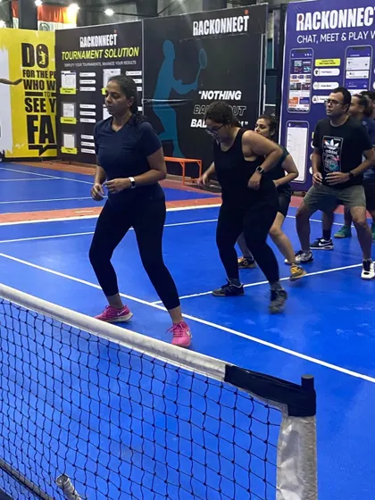 Players participating in a warm-up drill during a pickleball clinic. Proper warm-ups are key to preventing injuries and getting ready for the quick, dynamic movements of the game.