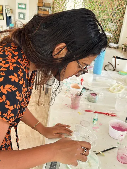 A participant at my eco-resin workshop, carefully mixing the materials.