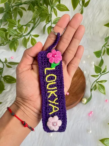 I also make these personalized name tag keychains. This one was for 'Loukya', made in a beautiful purple with little pink flowers.