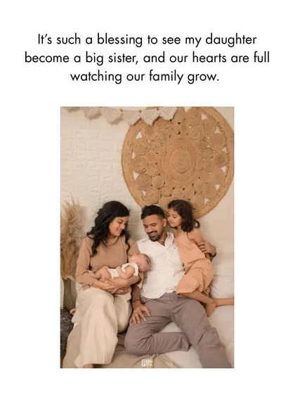 A loving family portrait capturing the blessing of seeing a daughter become a big sister.
