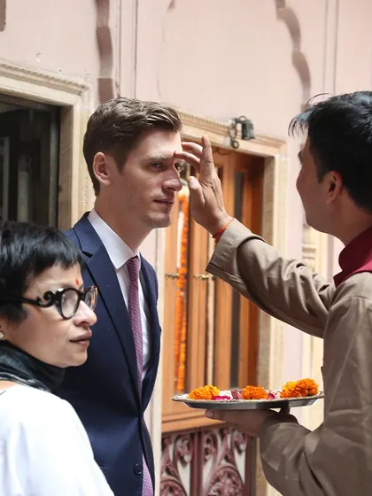 A traditional welcome for a guest at the Golden Haveli. Our goal is to offer an experience that is steeped in Indian culture and hospitality, complementing the architectural heritage of the space.