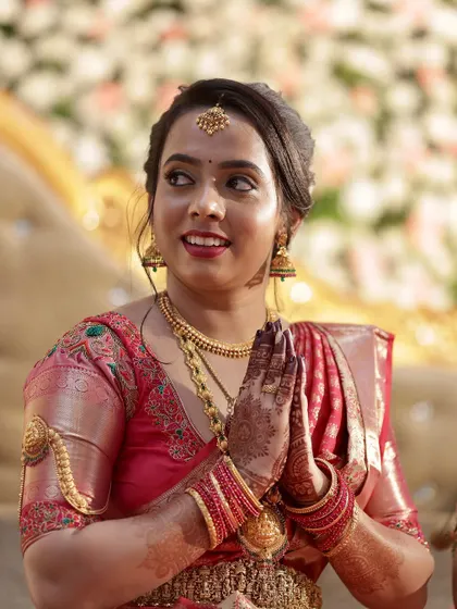 The bride during her ceremony. Her makeup is designed to look beautiful in person and in photos, capturing her joy and radiance.