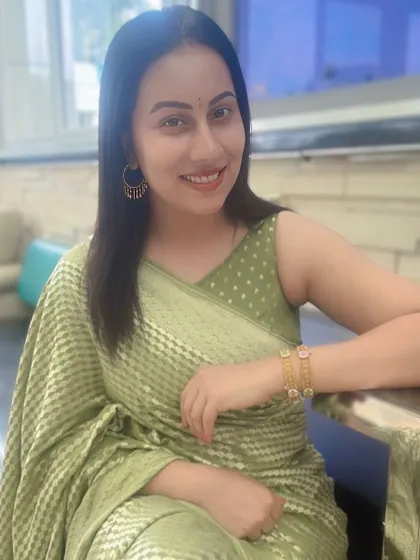 A close-up of Dr. Shruthi, her smile as bright as her beautiful, modern-style saree.