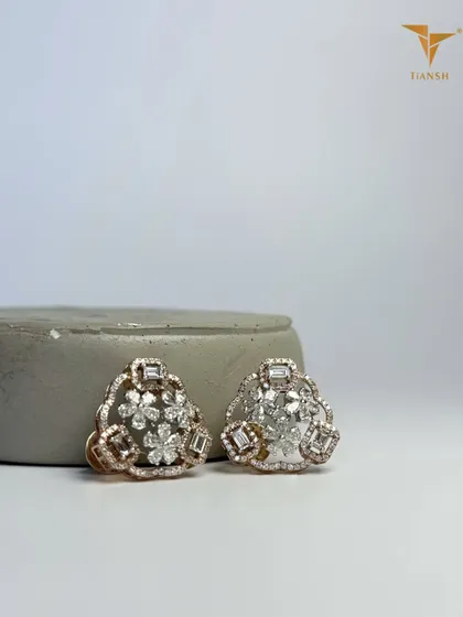 Diamonds shaped like blossoms, framed in baguette edges, and set against rose gold. These earrings carry both the softness of nature and the strength of timeless craft.