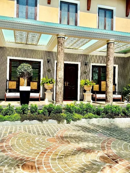 A duplicate of image 57, showing the completed mansion entryway.