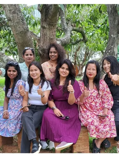 A ladies' team enjoying the green surroundings of our resort. Our property is a safe and welcoming space for all groups.