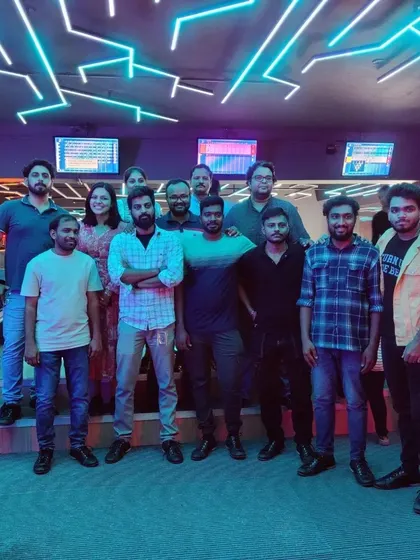 A large group of friends enjoying the neon-lit atmosphere of our venue.