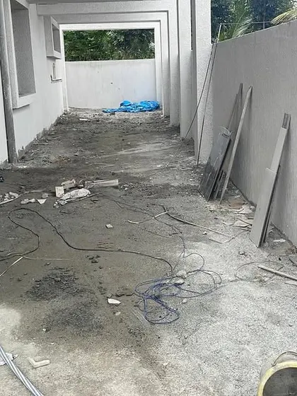Another view of a site before paving. Proper preparation of the ground is a critical step to ensure the final stone pathway is level and stable.