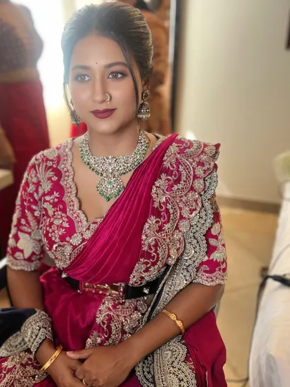 A seated portrait that shows off the complete look. The makeup is polished and sophisticated, perfect for a guest or family member at a wedding, expanding the range of services you can offer.