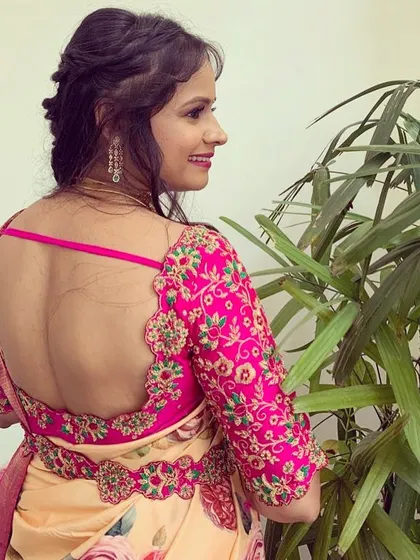 For this floral saree, I created a blouse with a daringly deep back, held together with simple straps for a modern and chic look.
