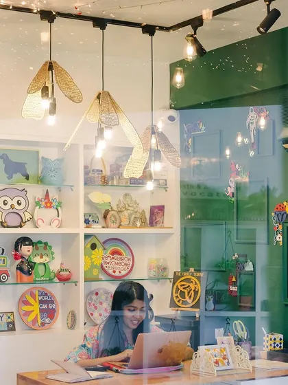 Looking through the window into our world of color and creativity. The studio is always buzzing with new ideas, and our shelves are filled with examples of what you can make, from painted owls to rainbow plates.