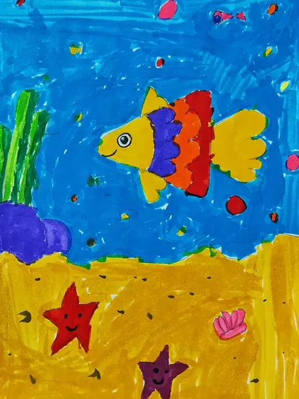 The final fish drawing, showcasing a creative mix of colors on its fins and a vibrant sea background.