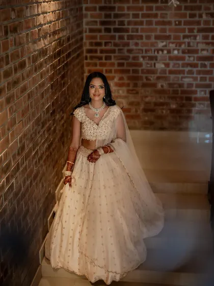 A beautiful portrait of the bride-to-be. Her makeup is soft and radiant, with a focus on glowing skin and subtly defined eyes.