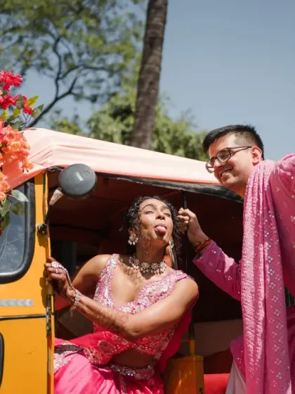 A playful moment where the groom feeds the bride while she makes a funny face. Their goofy energy is contagious and makes for a memorable and fun couple portrait.