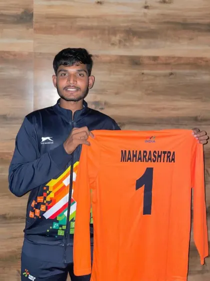 Shawn D'souza proudly holding the Maharashtra state jersey after his selection for the Khelo India Beach Games.