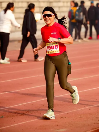 A smile of relief and happiness after a tough 10k on the track. Even when it hurts, the feeling of accomplishment is worth it.