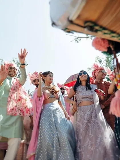 The baraat party in full swing, captured from a unique perspective. We find interesting angles to showcase the energy and scale of the procession.