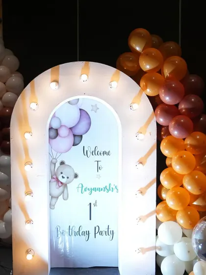 I used a trendy U-shaped LED light panel to frame this welcome board for a teddy bear themed party. It's a modern and eye-catching way to draw attention to the entrance.