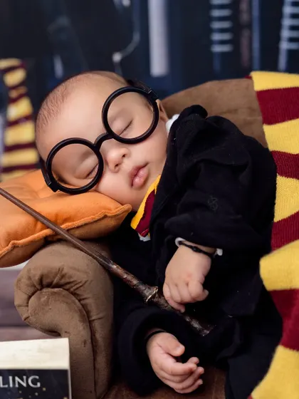 A perfect close-up of our sleeping wizard, complete with his iconic round glasses. It's these details that make themed shoots so special.