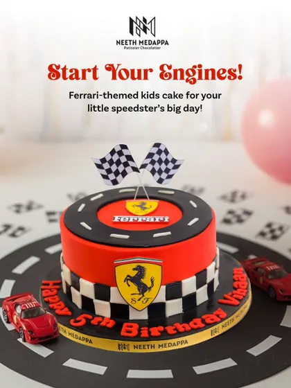Start your engines! A Ferrari-themed cake for a little speedster's 5th birthday, complete with the iconic red, checkered flags, and toy cars.