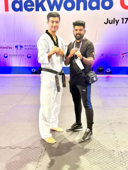 With a respected Taekwondo master at the international event.