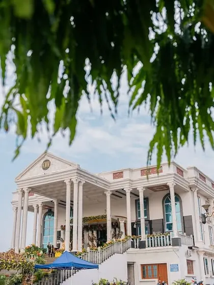 A wide shot of a grand, palatial wedding venue, setting the stage for a royal and elegant celebration.