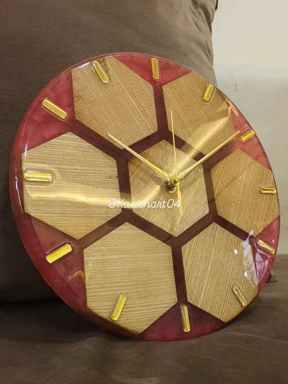 Another look at the honeycomb-themed wall clock, showing how the light reflects off the glossy resin surface. This piece can be customized in different colors to match your decor.