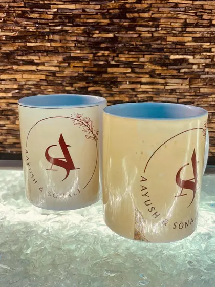 A view of the monogram side of the custom mugs, with the names "Aayush & Sonali" elegantly displayed. It's a great way to celebrate a couple's union.