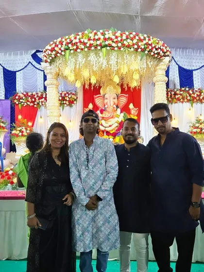 Posing for a photo during a Ganesh Chaturthi celebration for the Sun City community. We love performing at festivals and community events, bringing people together through music.