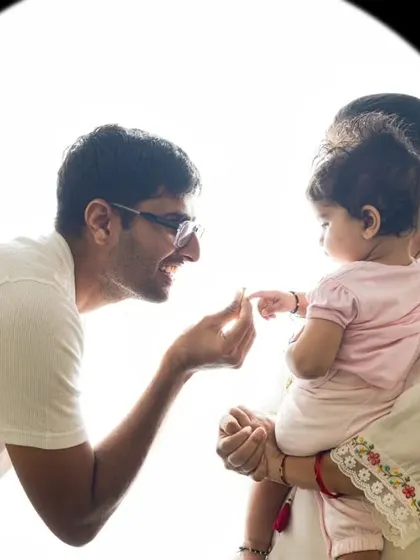 A tender moment between father and child, highlighted with beautiful backlighting. This style is perfect for capturing pure and simple connections.