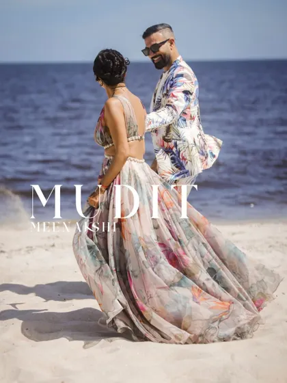 A stylish pre-wedding shot on a Thai beach, showing the couple's fashionable side.