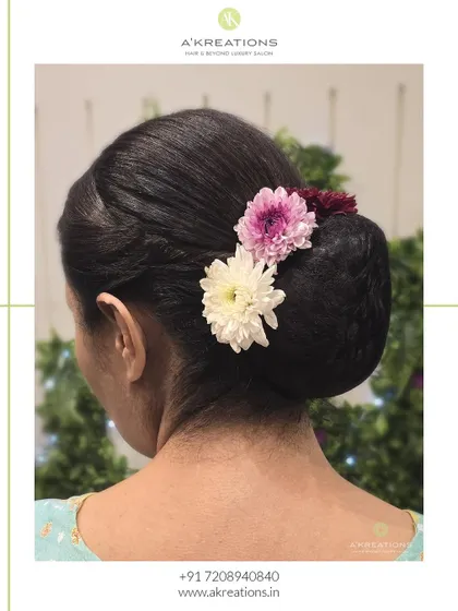 This classic hairstyle is perfect for showcasing an elegant neckline or statement earrings, offering a clean and sophisticated finish.