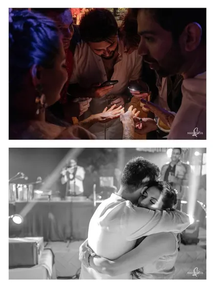 A groom searches for his name in his bride's mehendi by the light of phone torches. Below, they share a hug on the dance floor. These two images show the blend of playful and romantic intimacy.