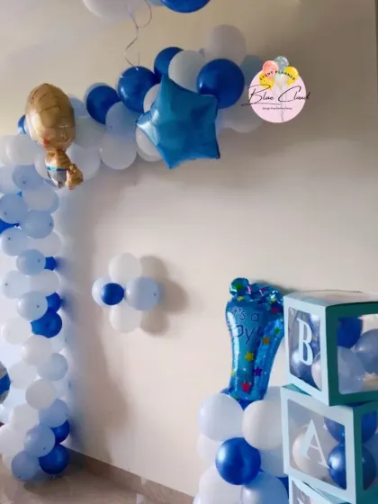 A blue and white balloon arch with 'BABY' blocks, perfect for a baby boy's welcome party or baby shower.