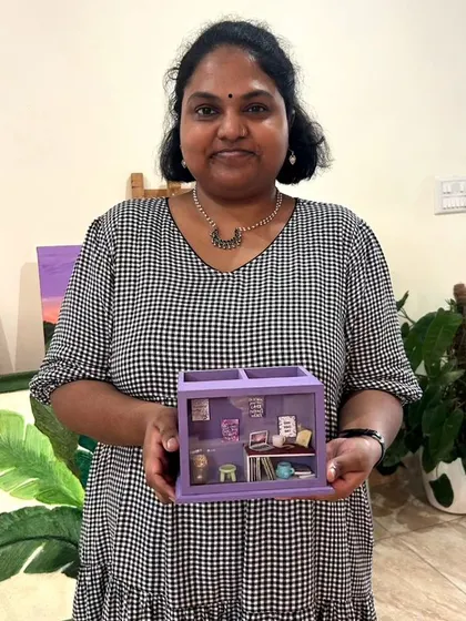 Another happy participant with her detailed shadow box creation.