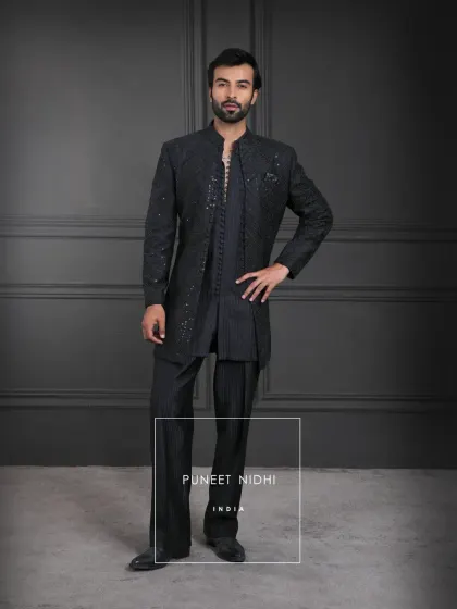 Black, the shade of mystery and strength, brought alive with geometric textures and looped buttons. This layered look is a reflection of India’s regal legacy reimagined.