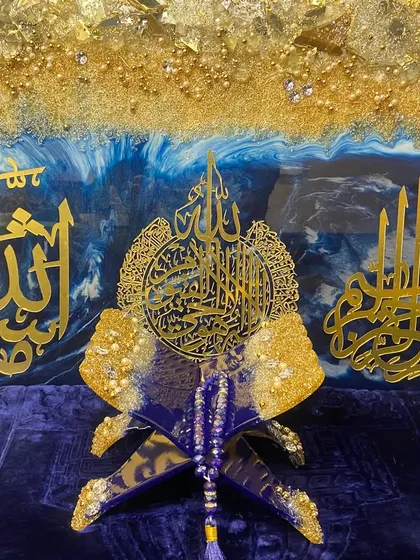 This shows how I can create a complete, coordinated look for a room. The set includes a large wall art piece with Ayat ul Kursi, Mashallah, and Bismillah calligraphy, alongside a matching Quran holder, all in a striking royal blue and gold theme.