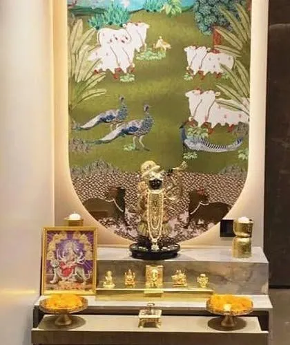 This sacred corner is dedicated to Shrinathji, featuring a stunning Pichwai art piece as the backdrop. I designed the multi-level platform in a clean, modern finish to beautifully contrast with the rich, traditional artwork. This setup shows how we can build a custom mandir space around a specific deity and art style that is special to you and your family.