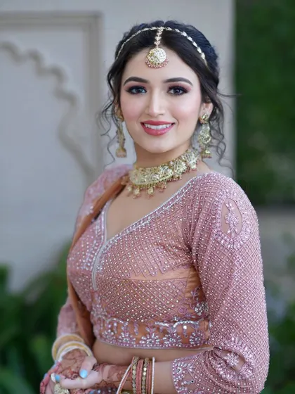 A happy bride with her neutral makeup look. The soft colors enhance her features without overpowering them.