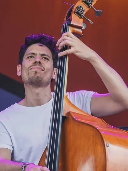 A close-up of our bassist during the Jetlag Music Festival performance. His solid grooves are the foundation of our sound, bridging jazz and Indian rhythms.