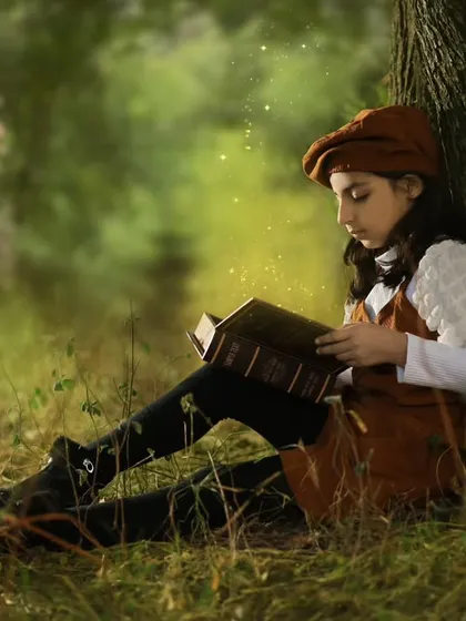 Another shot from my daughter's 7th birthday. The lighting and the quiet, thoughtful mood make this feel like a scene from a storybook.