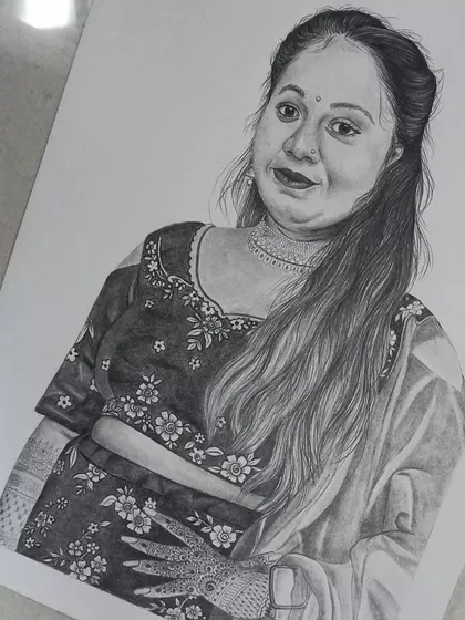 An angled shot of the finished A3 portrait, giving a better sense of the drawing's scale and presence on the paper.