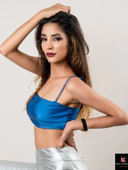A confident pose from the 'Lady in Satin' series. The model's hand on her hip and direct gaze exude power and style in this modern fashion shot.