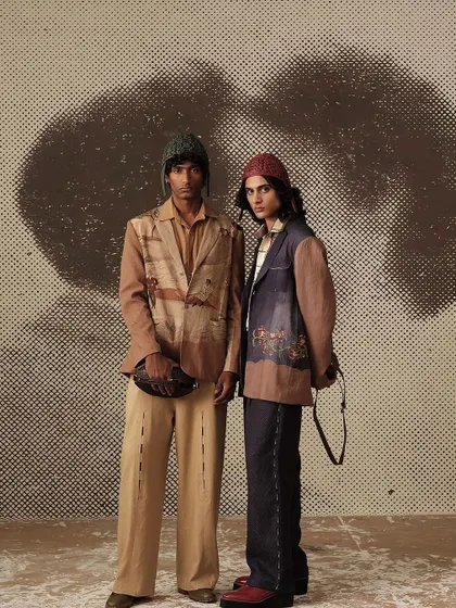 A shot from the "Vinyl Echoes" menswear campaign for Cord. The custom-painted, textured backdrop was created to evoke a sense of history and renewal, matching the collection's theme.