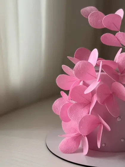A close-up of the modern pink wafer paper flowers, highlighting their clean shapes and beautiful arrangement.
