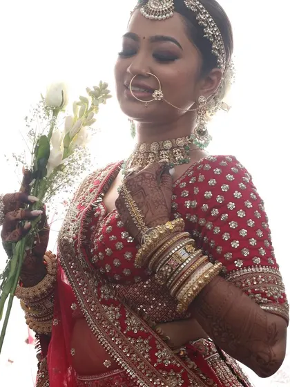 A serene bridal portrait. The soft lighting highlights the flawless base and gentle contouring, creating a look that is both timeless and romantic.