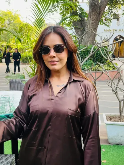 A moment of calm amidst the hustle. My personal style is about being comfortable and confident, whether I'm meeting clients or scouting locations.